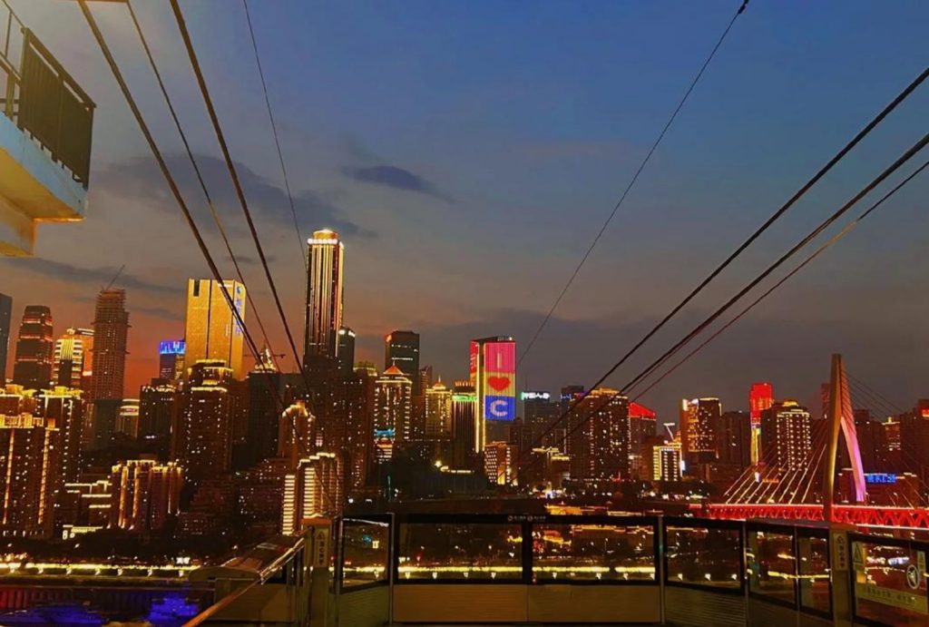 Enjoy the night view of Chongqing from the Yangtze River Cableway station.