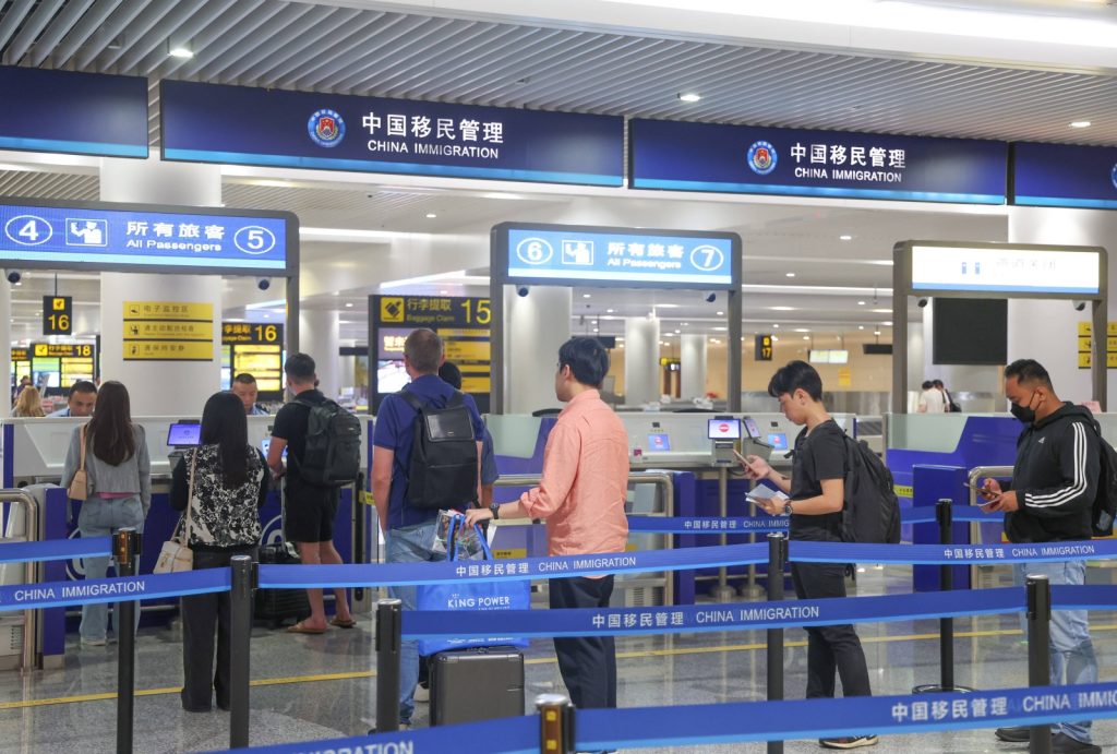 Inbound passengers queue at Chongqing Jiangbei Airport