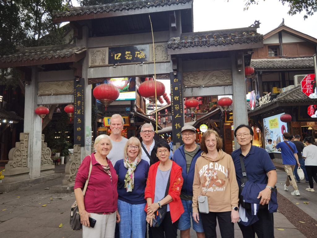 Tourists posing for a group photo at Ciqikou